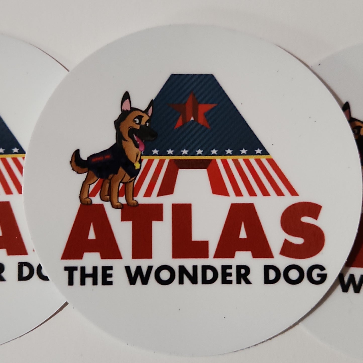 Cartoon style German Shepherd hero dog next to large red white and blue words that say Atlas the Wonderdog